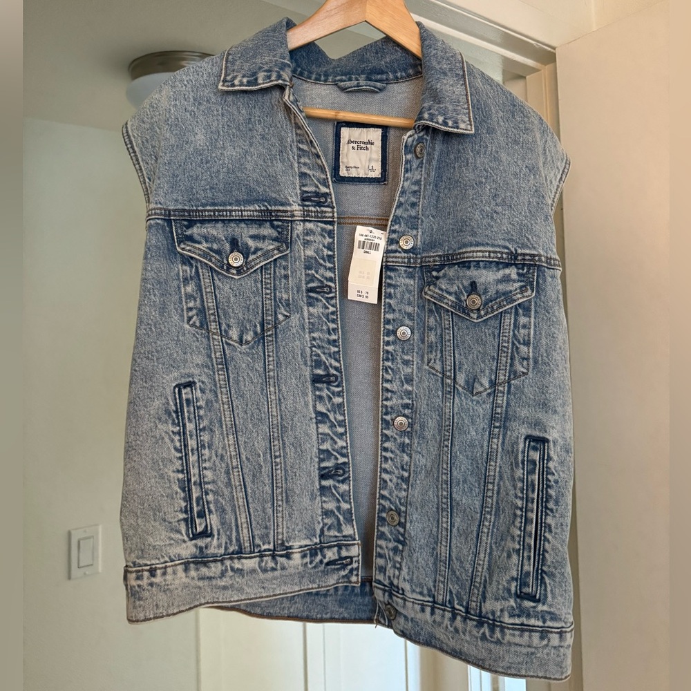 Brand new jean vest with tags! Size small, oversized!